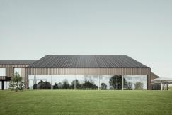 Am großen Konferenzsaal zeigt sich der perfekt detaillierte Übergang von der Fassadenbekleidung in die Dachfläche. Foto: Brigida González